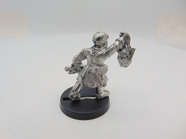 Steel Legion Sergeant with Chainsword & Ork Head